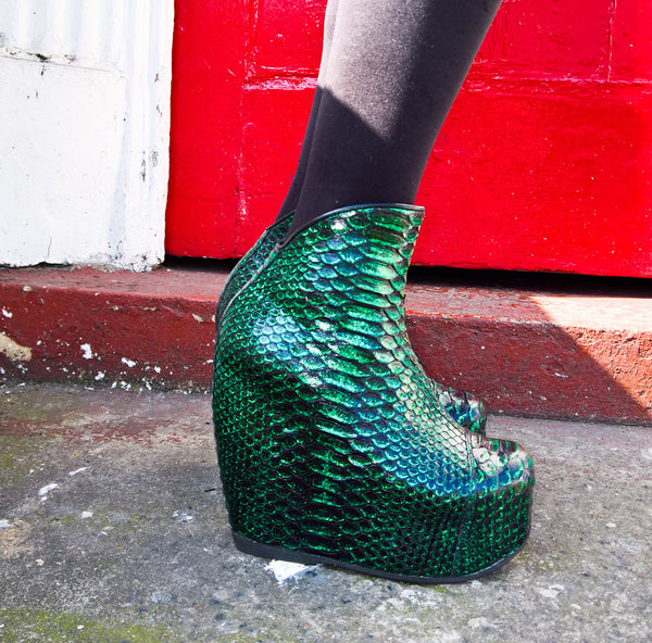 Model Wearing Mermaid Style Sea Green Platform Wedge Boots in Genuine Python Leather in front of red door